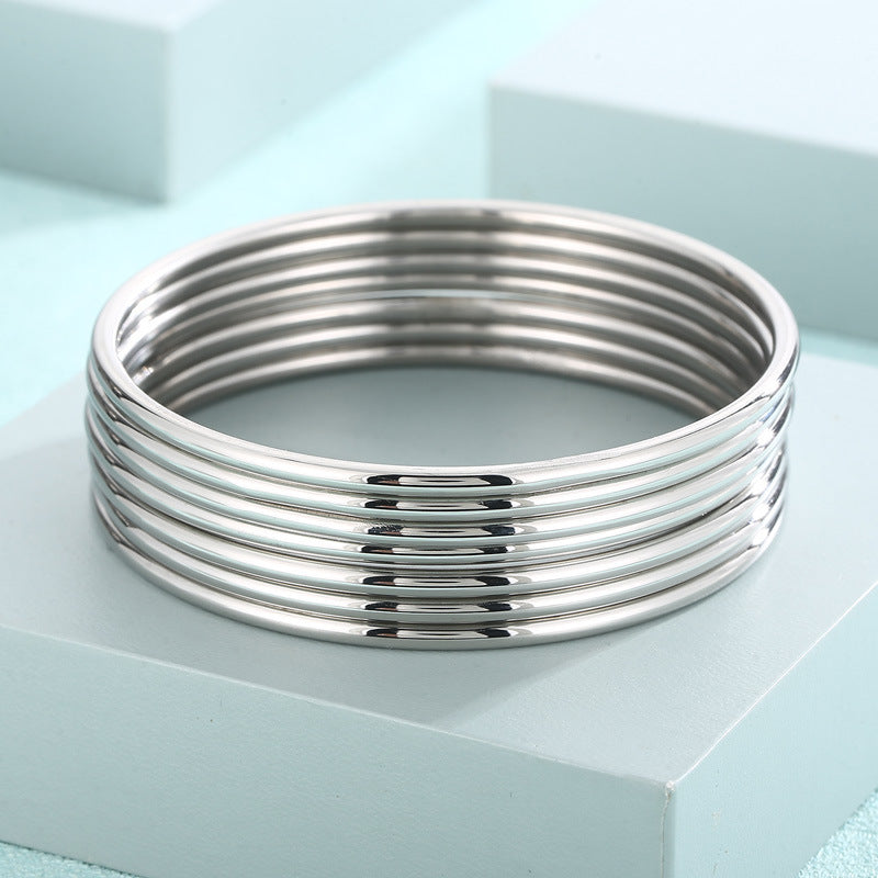smooth plain circular ring bracelet with multiple layers for wearing wristbands and accessories