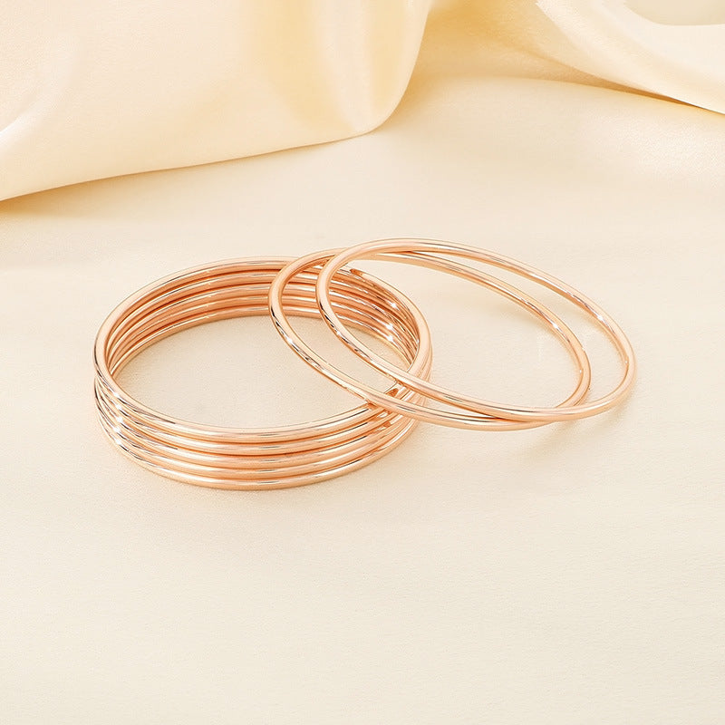 smooth plain circular ring bracelet with multiple layers for wearing wristbands and accessories