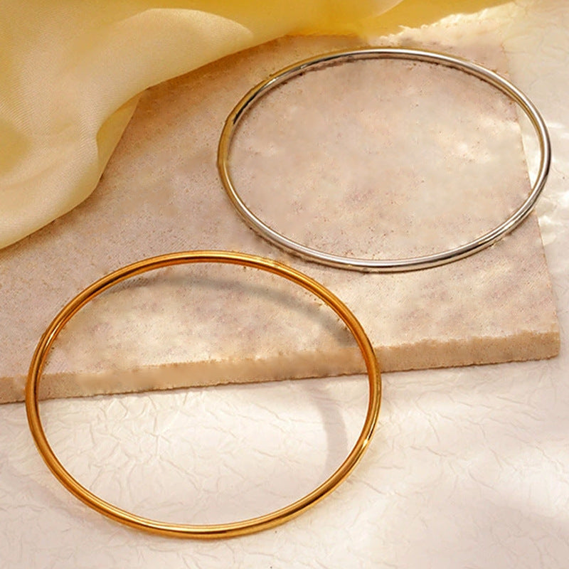 smooth plain circular ring bracelet with multiple layers for wearing wristbands and accessories