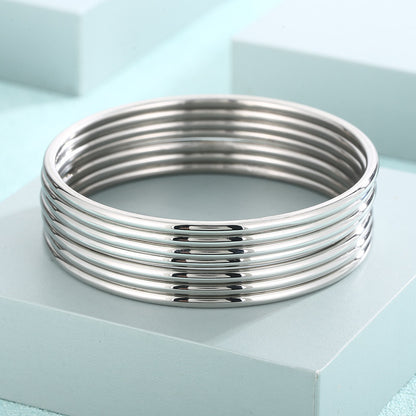 smooth plain circular ring bracelet with multiple layers for wearing wristbands and accessories